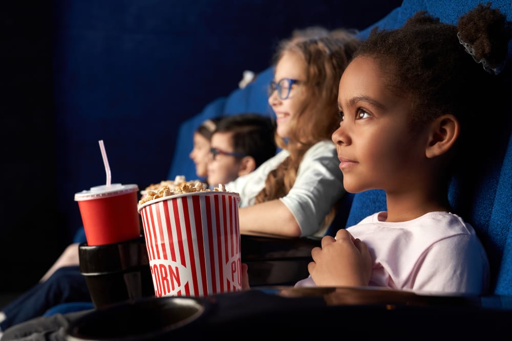 children with popcorn at the cinema