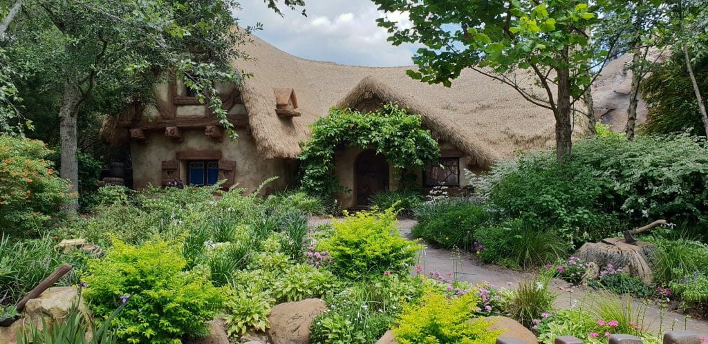 An enchanted house in a garden at Disney World