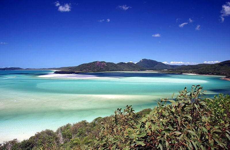 Beautiful Whitehaven Beach with turquoise water, white sand and greenery