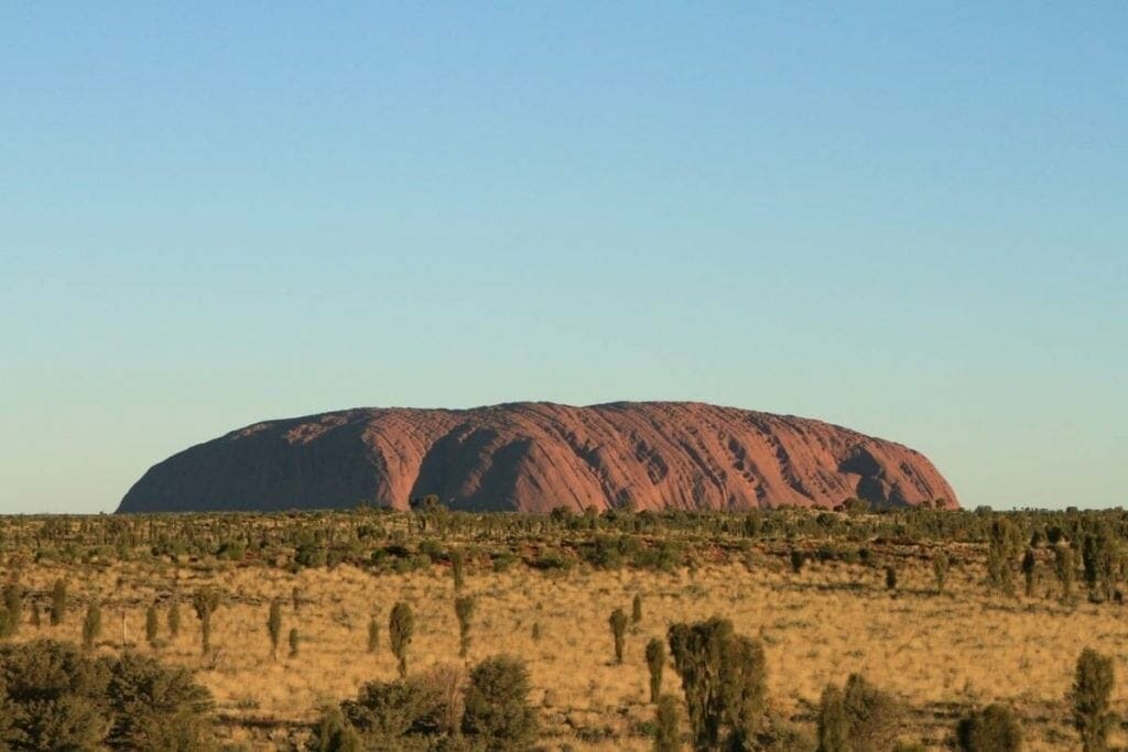 Uluru in the middle of the grassland