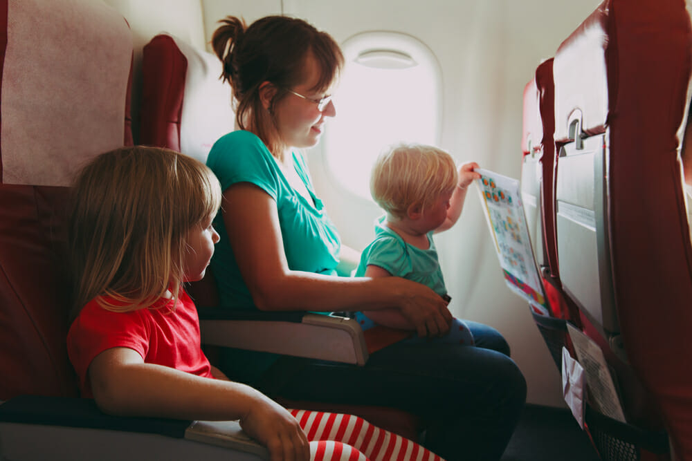 children plane travel flying Shutterstock