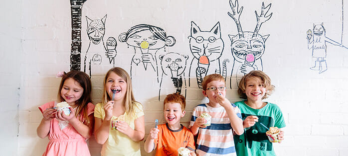 Kids leaning against wall, eating ice cream in Berry on South Coast