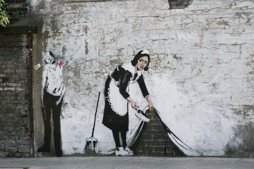 Maid Sweeping by Banksy