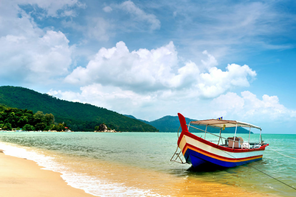 Boat pulled up on beach in Penang, Malaysia