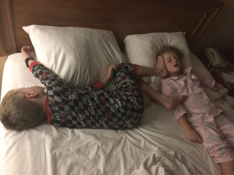 Kids sharing a hotel bed