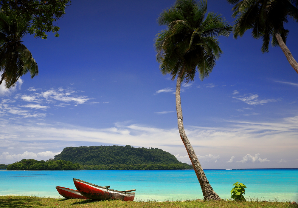 red canoes by the beach in Vanuatu