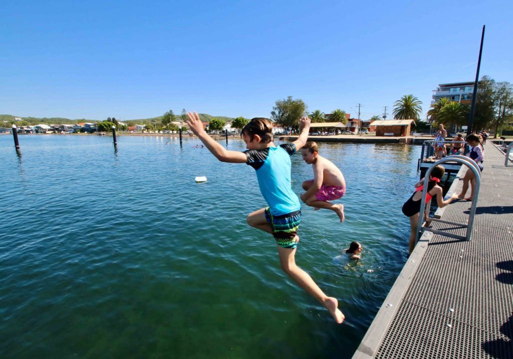 kids jumping off the Belmont Baths