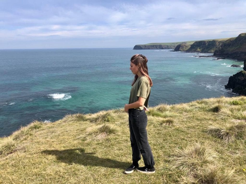 teen standing on cliff top in Victorian National Park