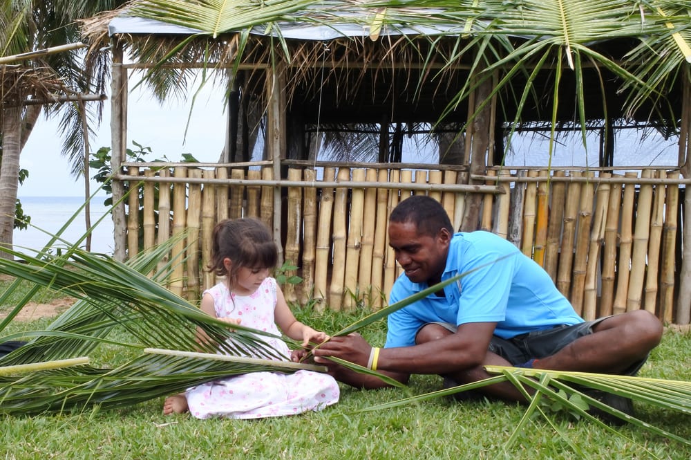 Learning to weave with coconut palm leaves in Fiji