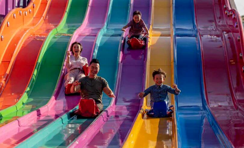 Family enjoying the carnival rides at the 2019 Sydney Royal Easter Show, Sydney Showground at Sydney Olympic Park.