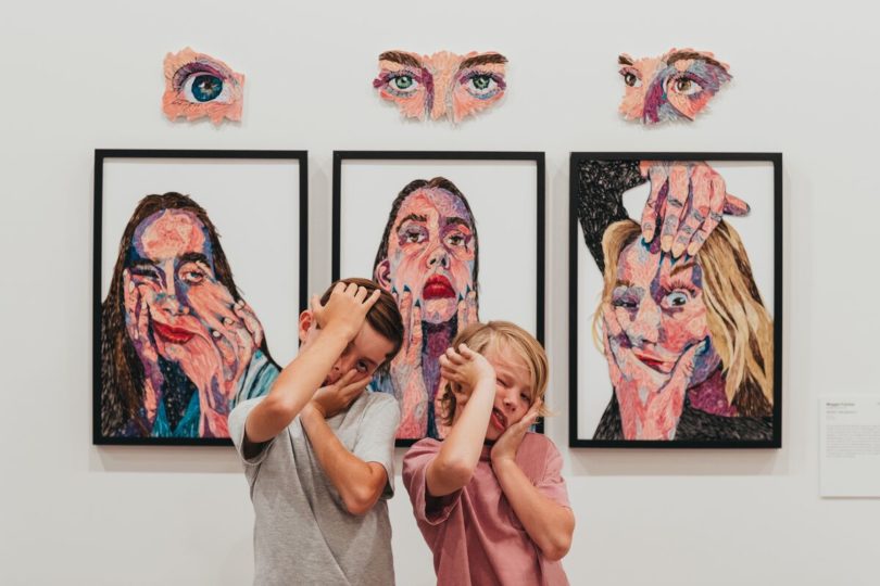 two kids pulling funny faces at the Maitland Regional Art Gallery